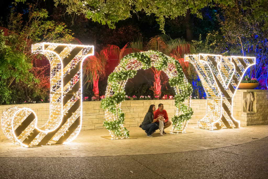 Photo opportunities abound at Houston Zoo Lights JOY sign in Christmas Lights